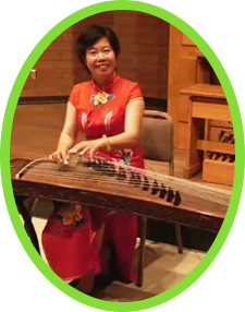 Performer Qin Xiao Ning demonstrates on the Chinese guzheng.