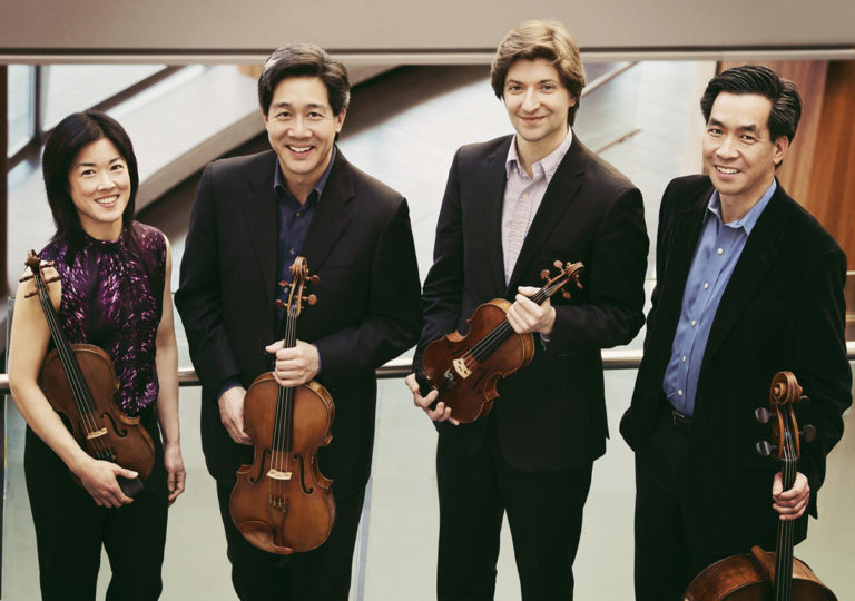 Members of the Ying Quartet smiling and looking at the camera.