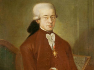 An oil painting of Mozart in his twenties, by an unknown artist. Mozart wears the medallion awarded him by the Pope.