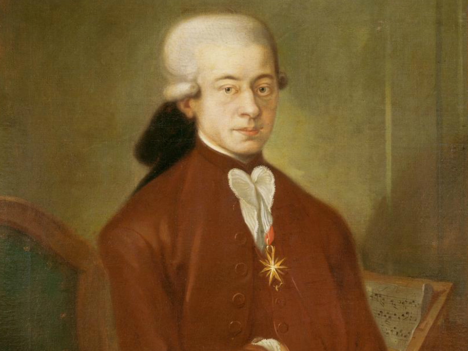 An oil painting of Mozart in his twenties, by an unknown artist. Mozart wears the medallion awarded him by the Pope.