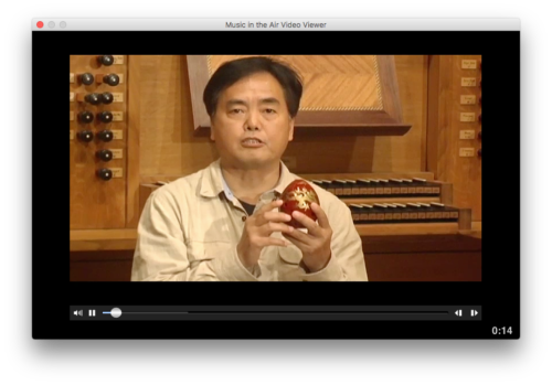 A screenshot of a video from MITA in which a Chinese performer describes traditional Chinese music